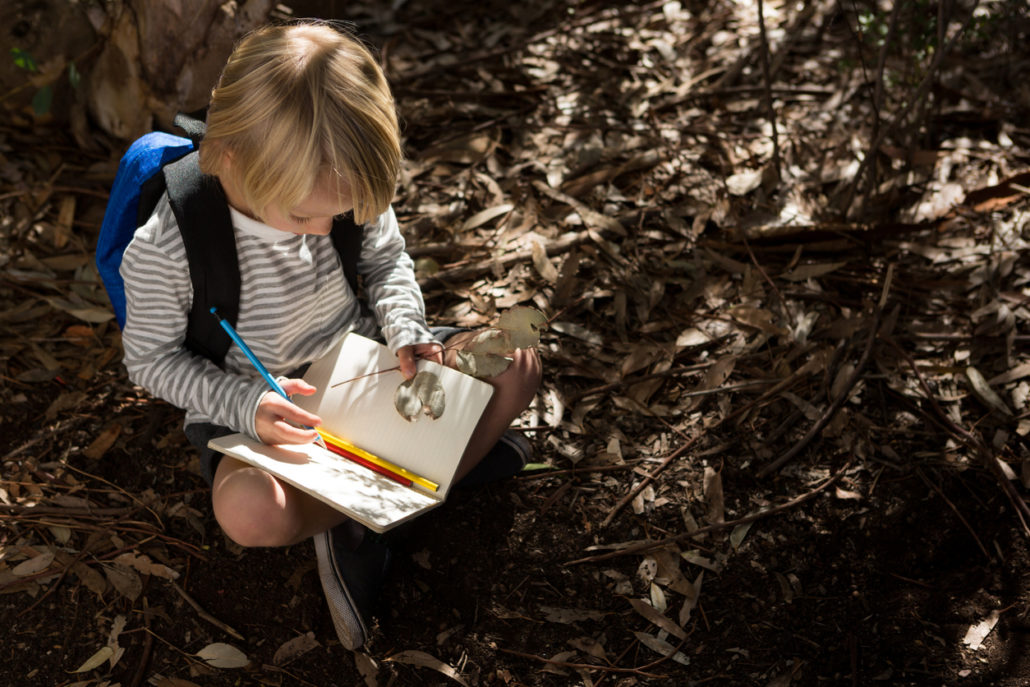 writing in her gratitude journal
